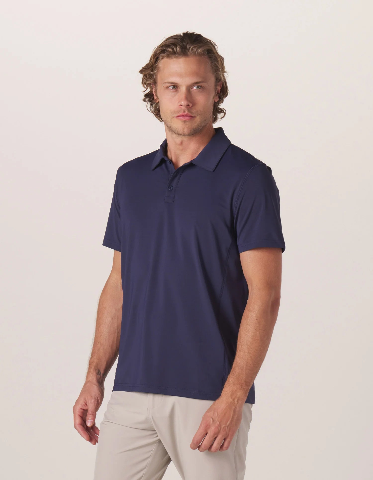 Crossback Seamed Performance Polo — Navy